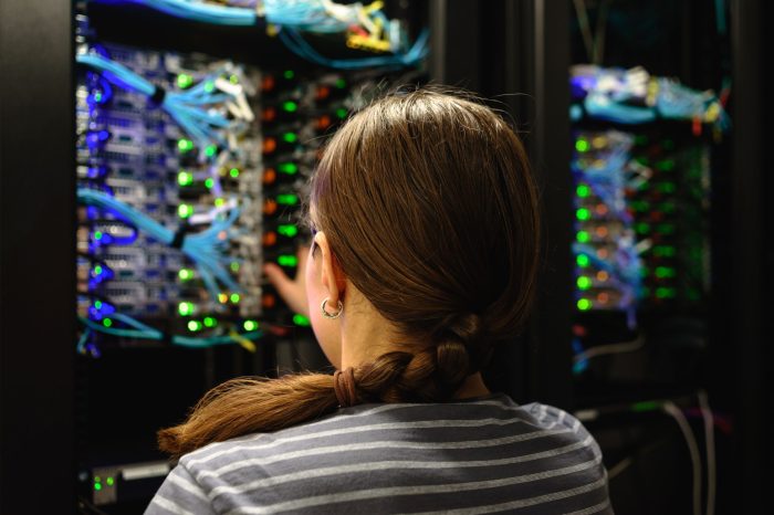 woman-networking-engineer-near-working-server-rack-2023-11-27-05-31-22-utc